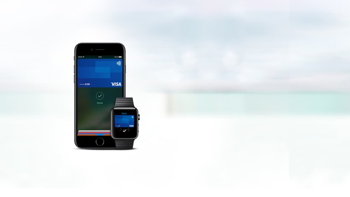 Telefone e smartwatch com Apple Pay
