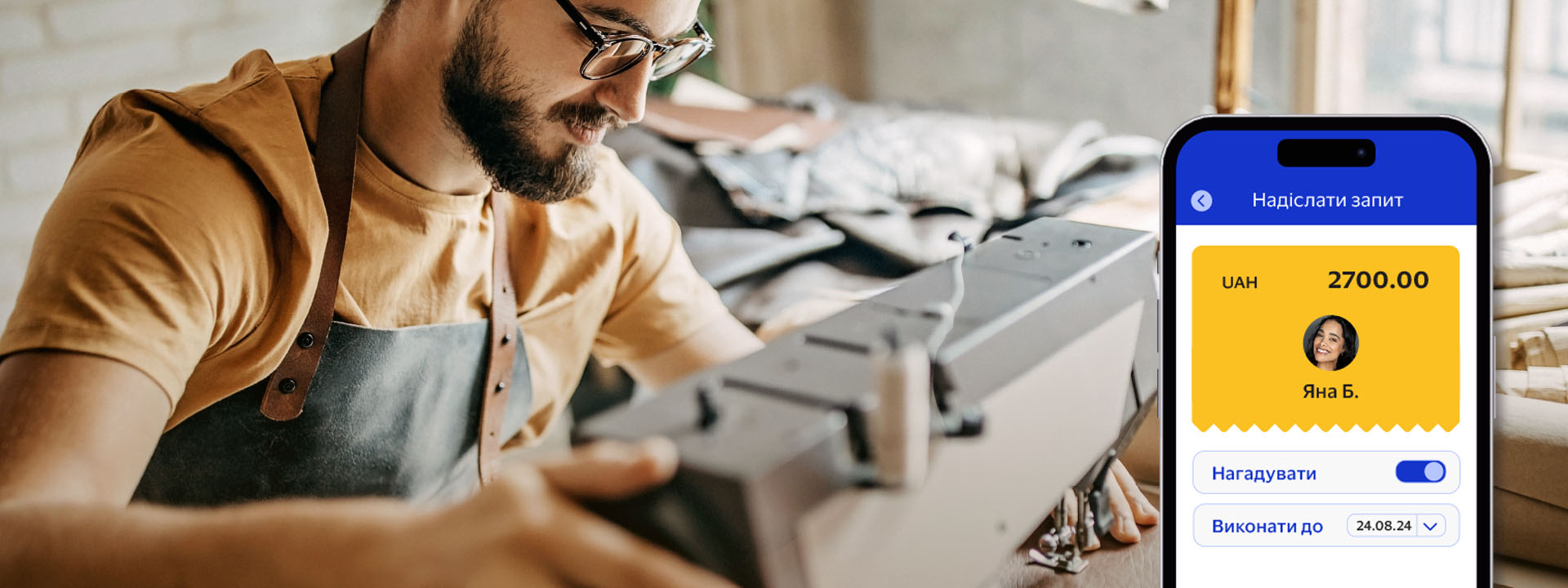 A person wearing glasses and an apron operates a sewing machine, focusing on their work.